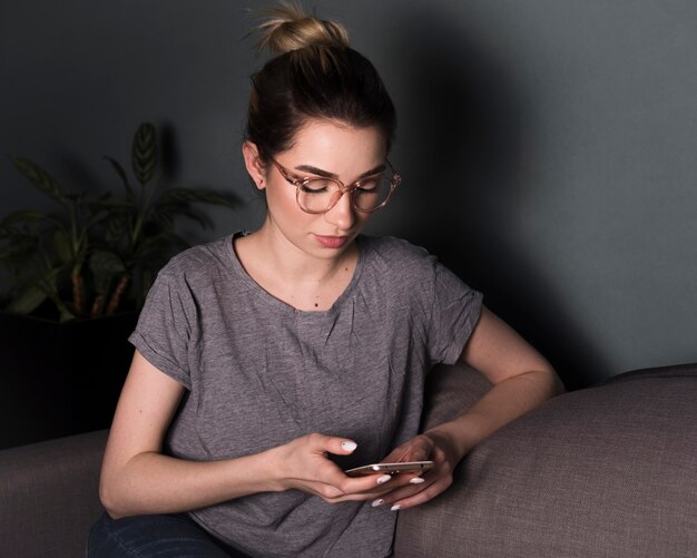 Front view of woman with smartphone