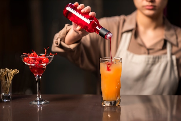 Free photo front view woman working as bartender