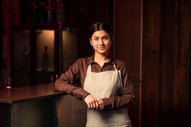 Free photo front view woman working as bartender