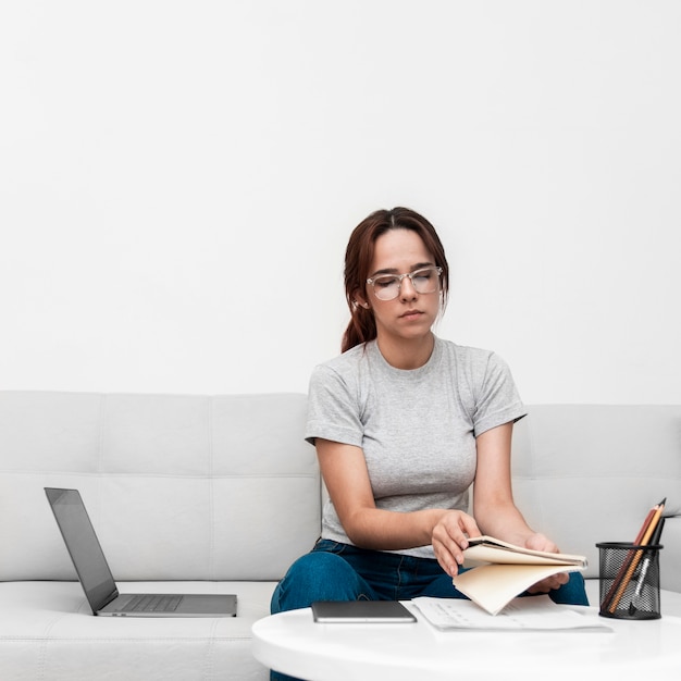 Front view of woman working from home