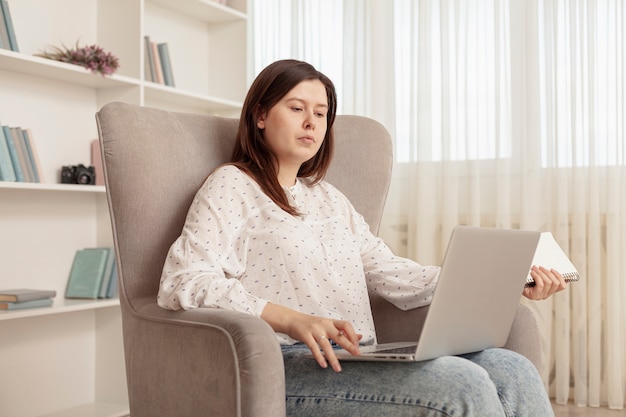 Free photo front view woman working from home