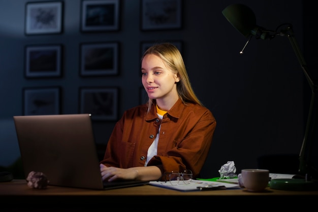 Front view of woman working at home