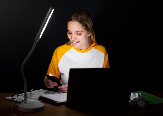 Front view of woman working at home