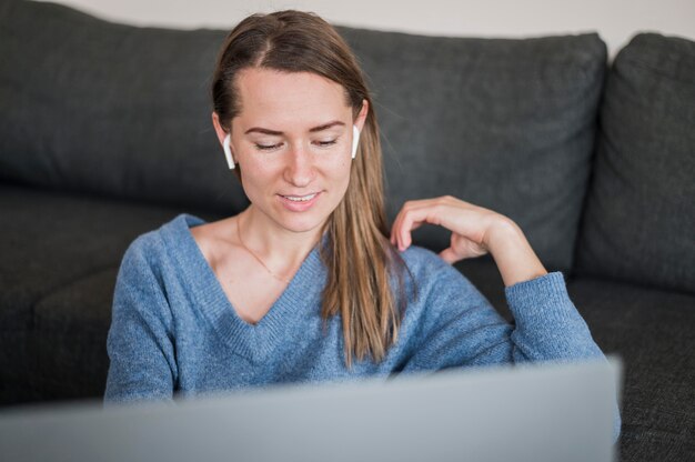 Front view of woman working at laptop