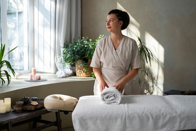 Front view woman working at a spa