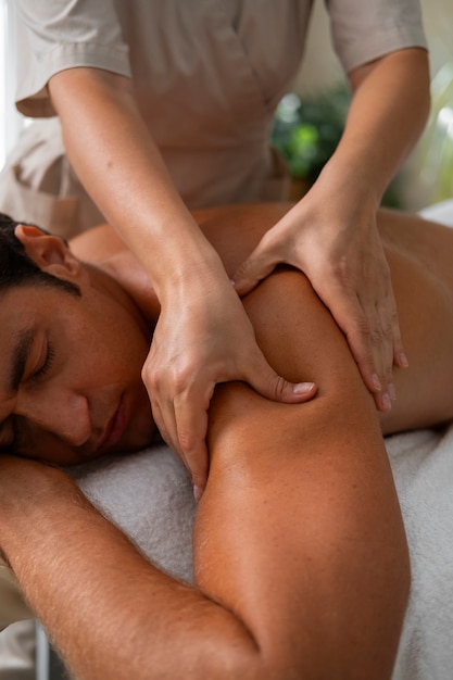 Free photo front view woman working at a spa