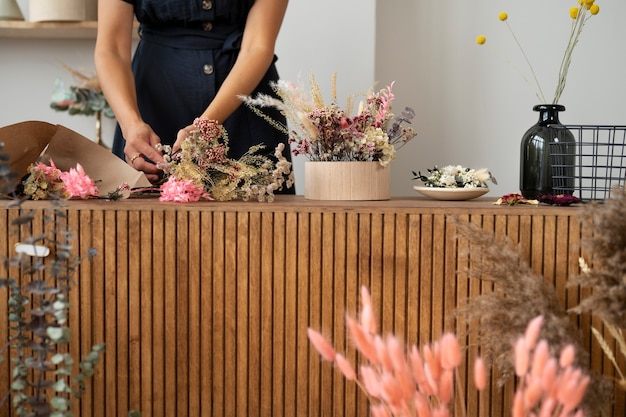 Front view woman working with flowers