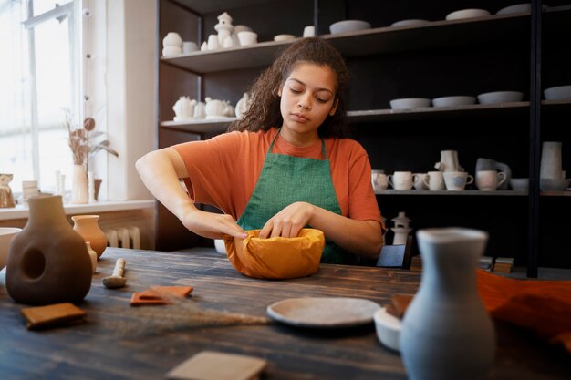 Front view woman wrapping bowl