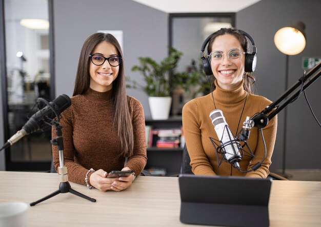 Front view of women broadcasting on radio