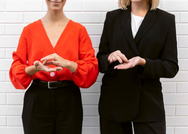 Front view of women using sign language