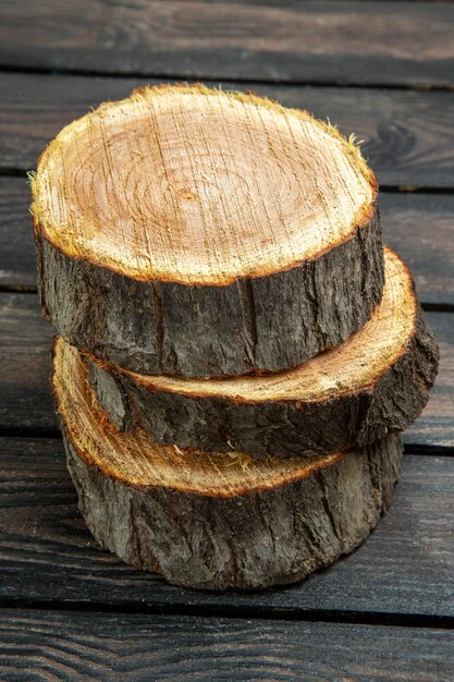 Front view wood pieces on a dark background color tree nature air forest wooden