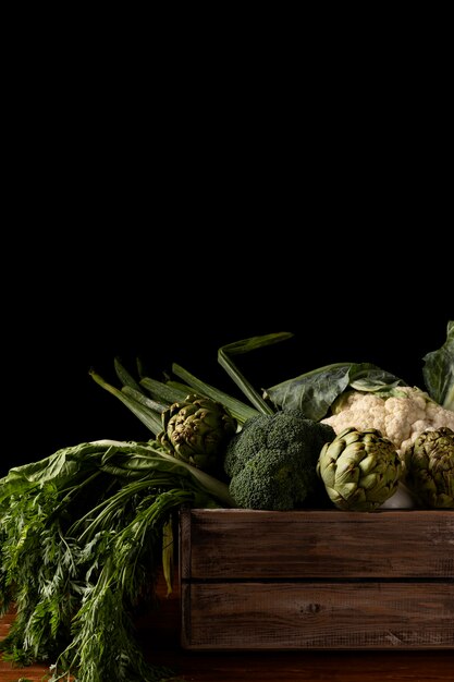 Front view wooden box with green vegetables