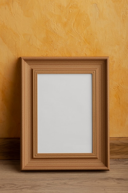 Free photo front view wooden empty frame