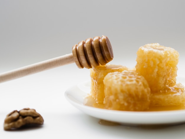 Free photo front view of wooden honey dipper