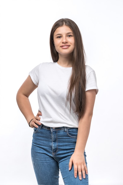 A front view young beautiful lady in white t-shirt and blue jeans posing and smiling