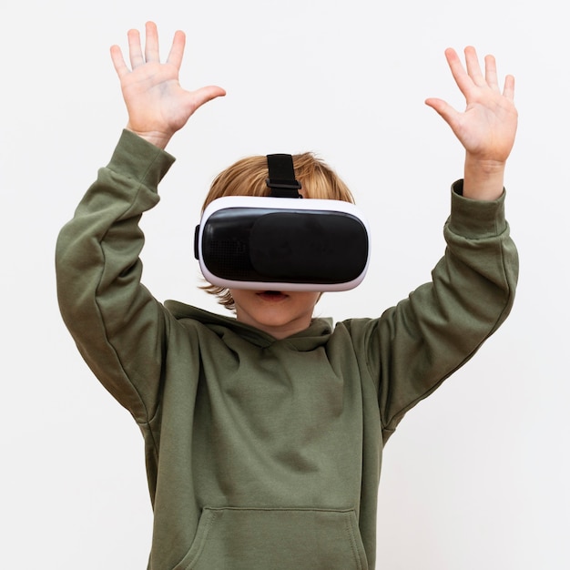 Front view of young boy using virtual reality headset