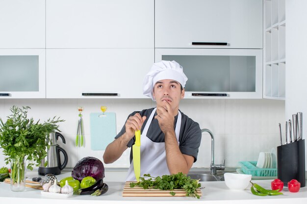 Front view young chef in uniform thinking