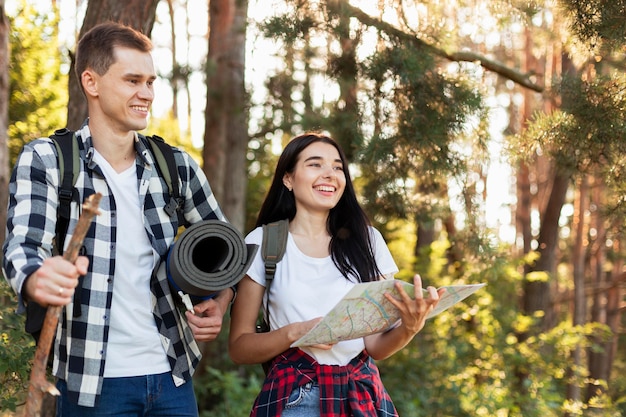 Front view young couple walking in the nature