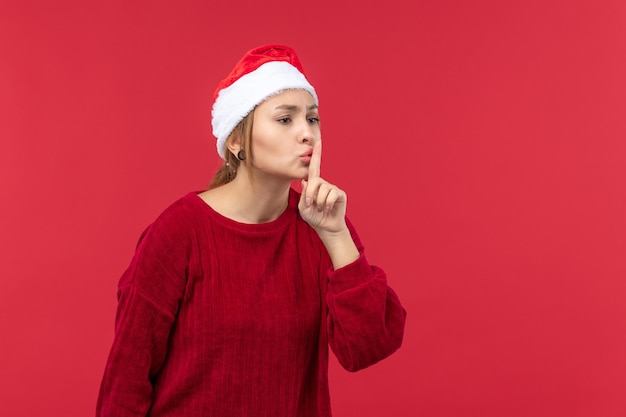 Front view young female asking to be quiet, holiday red christmas