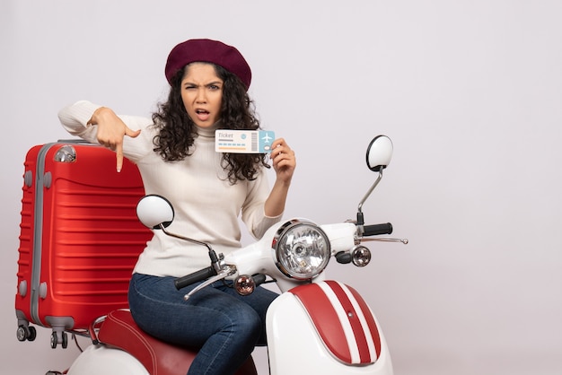 Front view young female on bike holding ticket on white background speed city vehicle motorcycle vacation money color road