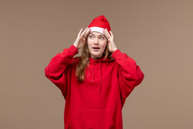 Free photo front view young female on brown background christmas emotion holiday