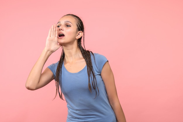 Free photo front view of young female calling someone on pink