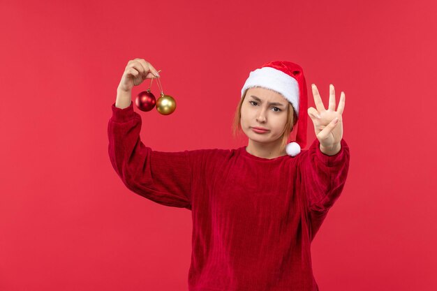 Front view young female counting showing number, holiday christmas emotion