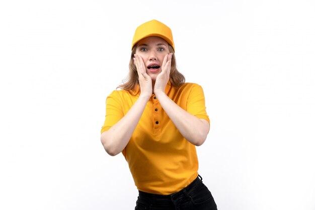 A front view young female courier female worker of food delivery service with worried expression on her face on white