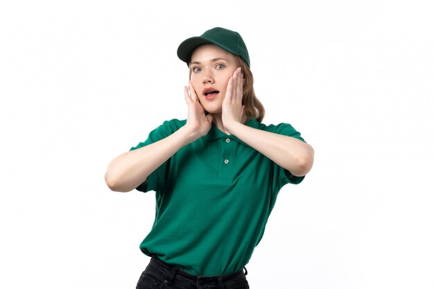 A front view young female courier in green uniform posing with coquette expression