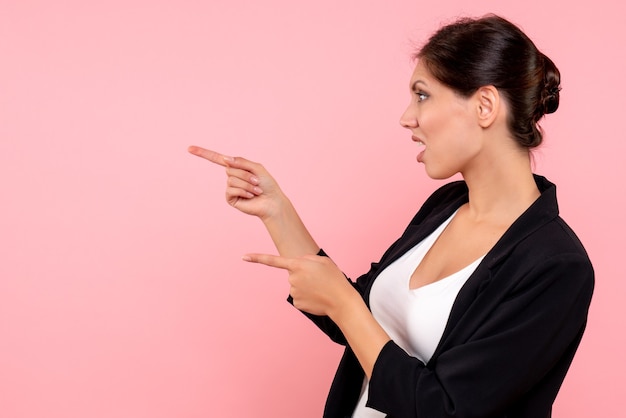 Free photo front view young female in dark jacket on a pink background