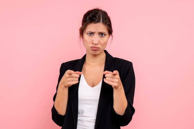 Free photo front view young female in dark jacket on a pink background