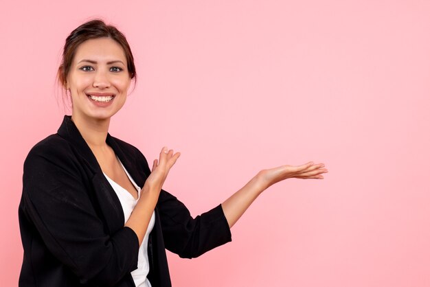 Front view young female in dark jacket on pink background