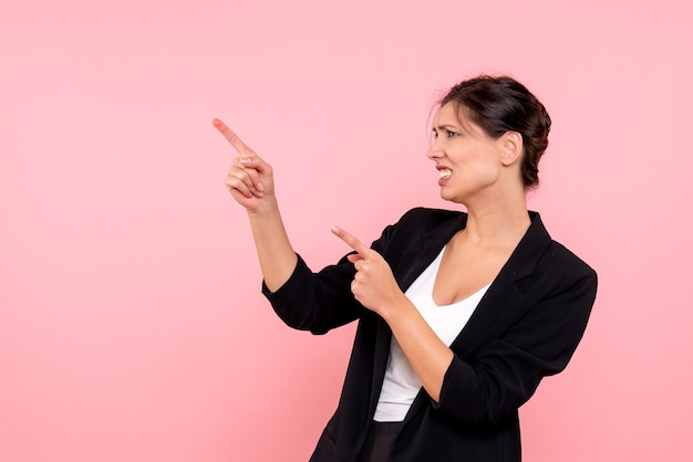 Free photo front view young female in dark jacket on pink background