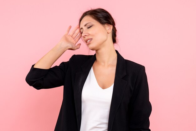 Front view young female in dark jacket on pink background