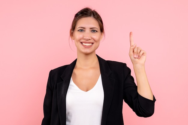 Front view young female in dark jacket on pink background