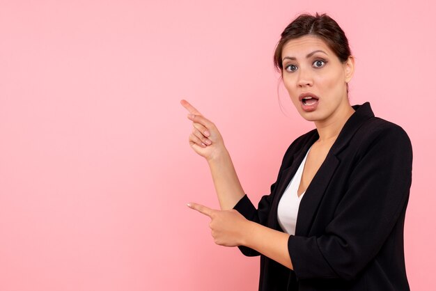 Front view young female in dark jacket on pink background