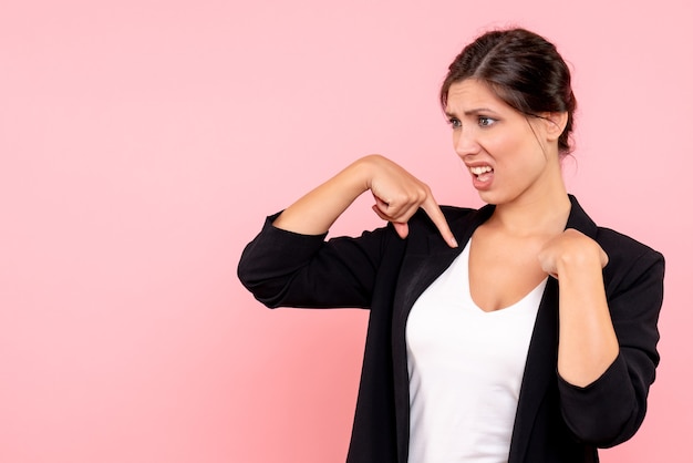 Front view young female in dark jacket on pink background