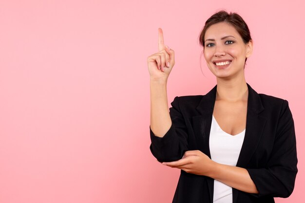 Front view young female in dark jacket on pink background