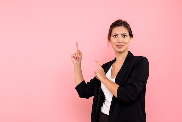 Front view young female in dark jacket on pink background