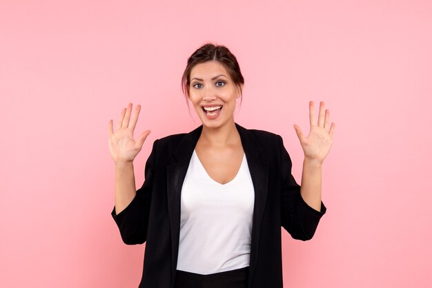 Front view young female in dark jacket on pink background