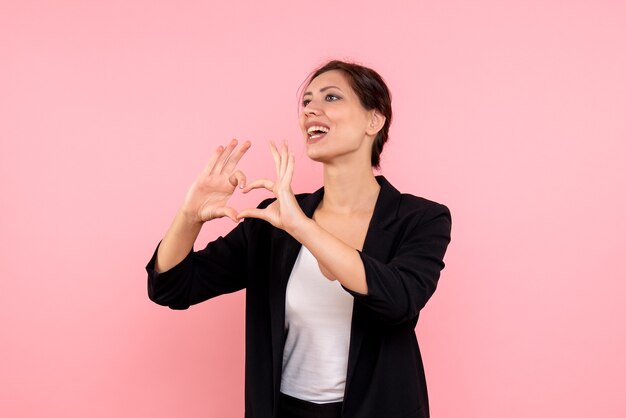 Front view young female in dark jacket on pink background