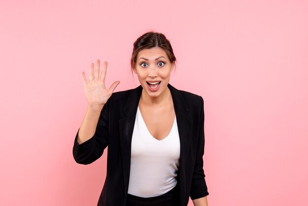 Front view young female in dark jacket on pink background