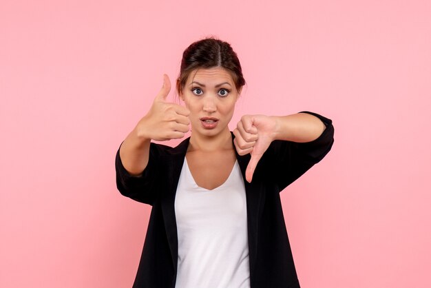 Front view young female in dark jacket on pink background