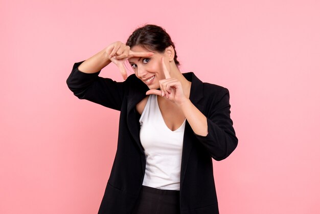 Front view young female in dark jacket on pink background