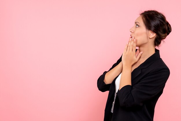 Front view young female in dark jacket on pink background