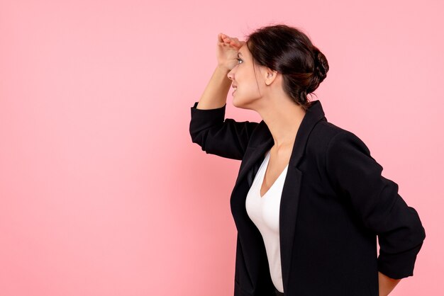 Front view young female in dark jacket on pink background