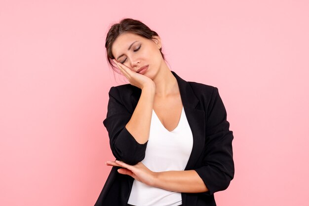 Front view young female in dark jacket on pink background