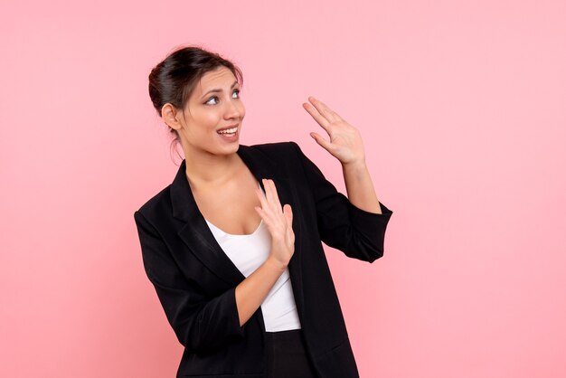 Front view young female in dark jacket on pink background