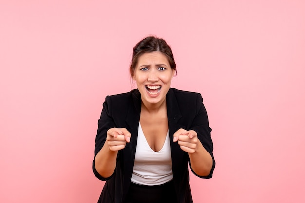 Free photo front view young female in dark jacket on pink background