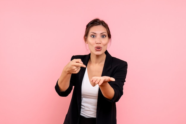 Front view young female in dark jacket on pink background